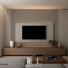 a modern living room with a flat screen tv on the wall