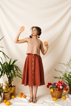 "🌿 DETAILS 🌿 ✳ Functional buttons down the front ✳ Darts around the waist ✳ A-line silhouette 🌿 DESCRIPTION 🌿 Full midi skirts were popular in the 1940s for their grace and elegance. Today, these highly versatile skirts are back in style. A trans-seasonal piece you can wear all year round, this skirt will allow for plenty of styling options and will no doubt become one of your favorite wardrobe staples. It's practical enough for everyday wear. Could be a workwear staple but it is also ideal for casual everyday moments. Say goodbye to all boring midi skirts, your closet deserves this vintage-inspired charm! 🔸Please note that due to the many variations in monitors and browsers, actual colors may vary.🔸 🔸Different colors and sizes are available.🔸 🌿 SIZES & MEASUREMENTS 🌿 The model i Modest Spring Fashion, Linen Top Outfit, Midi Rock Outfit, Linen Two Piece Set, Spring Fashion Ideas, Linen Midi Skirt, Full Midi Skirt, Retro Skirt, Rock Outfit