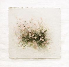 a white square with pink flowers on it