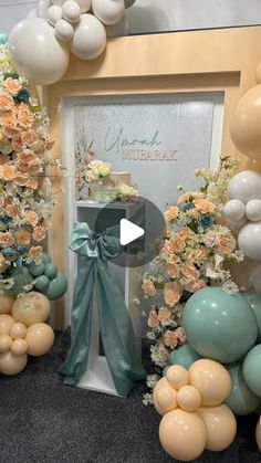 balloons and flowers are arranged in front of a door