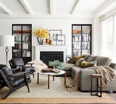 a living room filled with furniture and a fire place