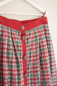 Retro frilly skirt from 1970s with check pattern / Folk skirt / Vintage country girl mid calf length skirt * size Large Folk skirt with red and green check pattern and decorated with big buttons in the front and sides. This vintage broomstick skirt will be perfect for country styled outfits. Additionally, it will look good in boho/hippie style. Has a lot of pleats (a lot of material was used to create this skirt) and reaches to mid-calf/ankle - depends how tall you are. Please check measurements Retro Full Skirt In Plaid, Retro Red Lined Skirt, Retro Gingham Cotton Skirt, Retro Red Cotton Skirt, Retro Plaid Flared Skirt, Vintage Pleated Plaid Skirt, Retro Knee-length Plaid Skirt, Vintage Plaid Pleated Skirt, Retro Plaid Full Skirt