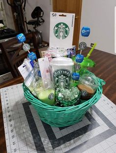 a basket filled with starbucks products on top of a table