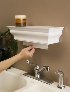 This crown molding shelf hides your paper towels. | 36 Genius Ways To Hide The Eyesores In Your Home Crown Molding Shelf, Paper Towel Dispenser, Shelf Paper, Towel Dispenser, Viria, Crown Molding, Diy Kitchen, Cleaning Tips, Paper Towel