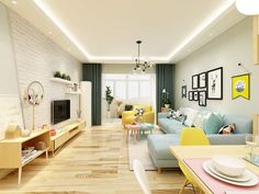 a living room filled with furniture and a flat screen tv mounted to the wall next to a dining table