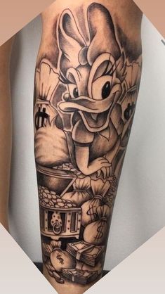 a cartoon character tattoo on the leg