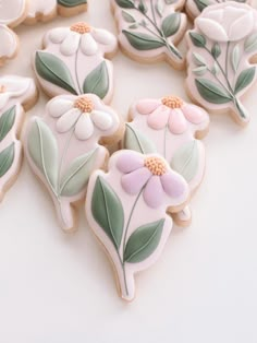 decorated cookies with flowers and leaves on them