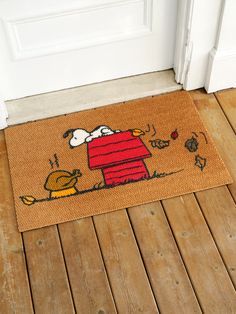 a door mat with a snoopy dog on it