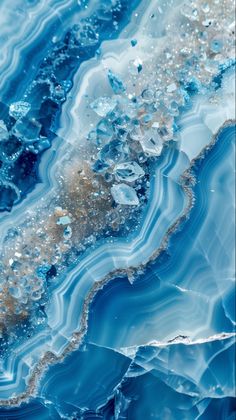 an abstract painting with blue and brown colors on it's surface, including ice crystals