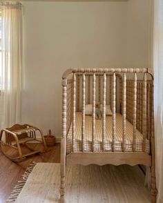 a baby crib in the corner of a room