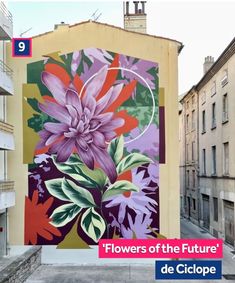 a large flower painted on the side of a building