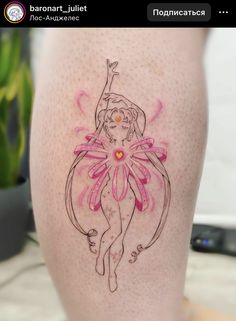 a woman's leg with an artistic tattoo design on the side of her thigh