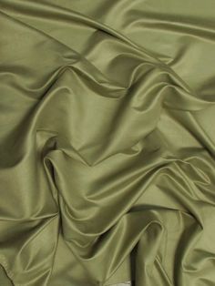 a close up view of a green fabric