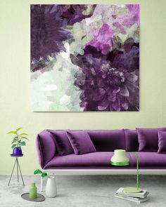 a living room with a purple couch and painting on the wall