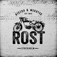 a black and white photo of a motorcycle on a brick wall with the words rost stockholm