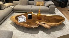 a living room with couches, tables and furniture on display in the store's showroom