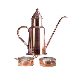 a copper colored coffee pot and two small pots with handles on each side, set against a white background