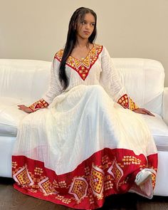 This Habesha Kemis, a traditional Ethiopian garment, radiates beauty and elegance, reflecting the rich cultural heritage and craftsmanship of Ethiopia. This exquisite dress showcases a perfect harmony of handwoven fabric, intricate embroidery, the use of Menen fabric, lightweight cotton, and quality thread, creating a stunning ensemble that captivates the eye and the heart. At the core of the Habesha Kemis lies the handwoven fabric, a testament to the skill and dedication of Ethiopian weavers. U Habesha Traditional Dresses, Zuria Habesha Dress, Ethiopia Clothing, Eritrean Clothing, Eritrean Dress, Mother Africa, Ethiopian Clothing, Habesha Dress, Ethiopian Traditional Dress