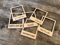 wooden cutouts with sayings on them sitting on top of a wood floor next to each other