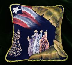 a decorative pillow with an image of three people riding on top of a hill in front of the american flag