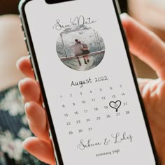 a person holding a phone with a calendar on the screen