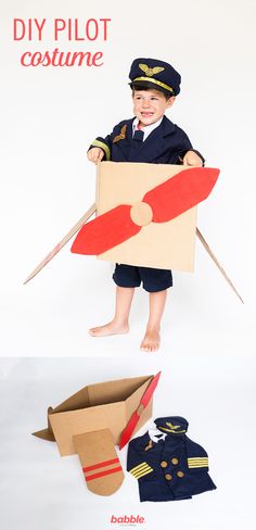 a little boy dressed up as a pilot holding a cardboard box and plane cutout