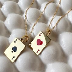 Get them solo or get the set! The set includes a playful pair of queen suited pendants, one for you and one for your bestie. The queen of hearts (♥) and queen of spades (♠) are neatly detailed in enamel. Pendants measure 15mm x 11mm. Chain is adjustable between 14" and 17.5". This is our grownup take on the classic friendship charm necklace and part of our BFF Charm Collection; tiny charms thoughtfully designed for you and your bestie. Each necklace in the two piece set is strung with a charm ha Queen Of Hearts Necklace, Bestie Necklaces, Marvel Script, Cards Necklace, Tiny Charms, Enamel Pendants, Bff Necklace, Bff Jewelry, Sun And Moon Necklace