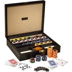 an open box with playing cards, dices and other items in it on a white background