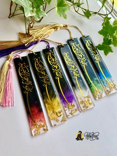 five different colored incense sticks with writing on them