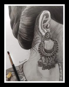 a pencil drawing of a woman's ear with earrings on top of her head