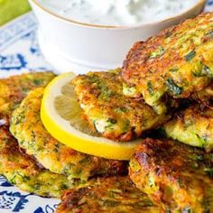 zucchini fritters with lemon wedges and yogurt