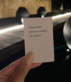 someone holding up a card that reads, i have the power to make an impact