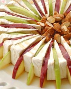 an apple and cheese dessert with nuts on top