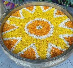 a large metal tray filled with yellow and white flowers