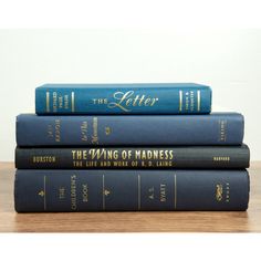 three books stacked on top of each other