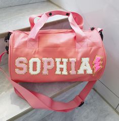 a pink bag with the word sophia on it