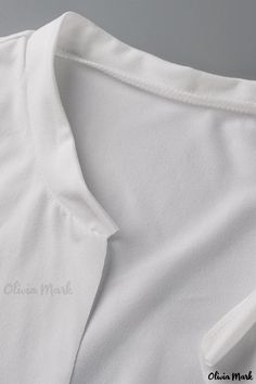 Olivia Mark - Womens White V-Neck T-Shirt Featuring Stylish Print Design White Layering Tops, White Tops For Layering, White Stretch V-neck Shirt, White V-neck T-shirt, White V-neck Solid Color T-shirt, Plain White V-neck Top, White Plain V-neck Top, White Solid Color V-neck T-shirt, White V-neck Top