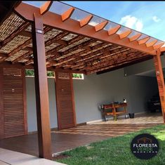 an outdoor covered patio with wooden slats