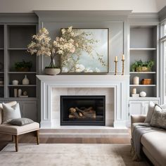 a living room filled with furniture and a fire place in front of a painting on the wall