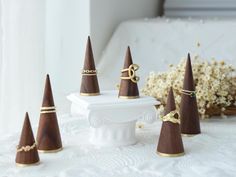 small wooden cones sitting on top of a white table