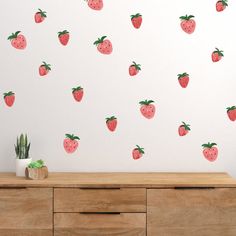 a wall with strawberries painted on it