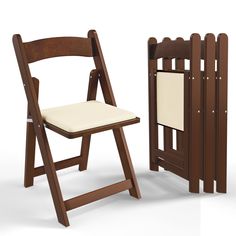 a wooden folding chair next to a white padded seat