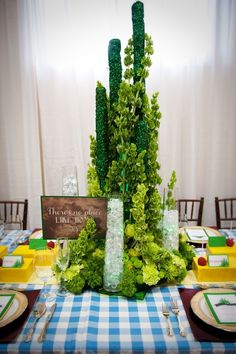 a table set up with place settings, plates and utensils for an event