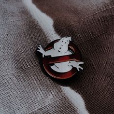 a ghost pin sitting on top of a cloth