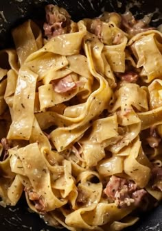 pasta with meat and sauce in a skillet ready to be cooked on the stove