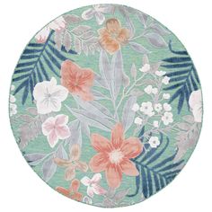 a round rug with flowers and leaves on it