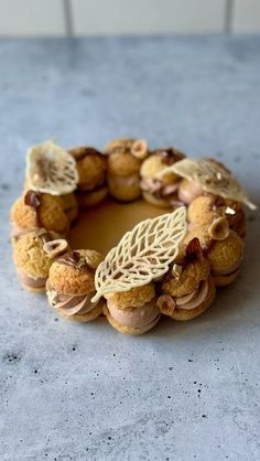 a pastry is sitting on the table with nuts and other things in it's center