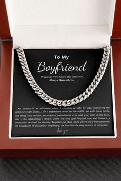 a box with a necklace in it and the words to my boyfriend written on it