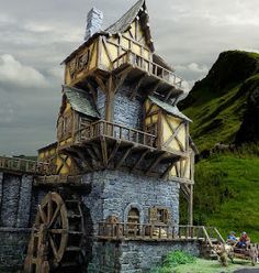 a house made out of wood and stone on the side of a hill with people standing outside