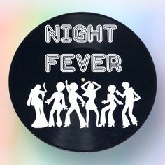 a black record with the words night fever on it and silhouettes of people dancing